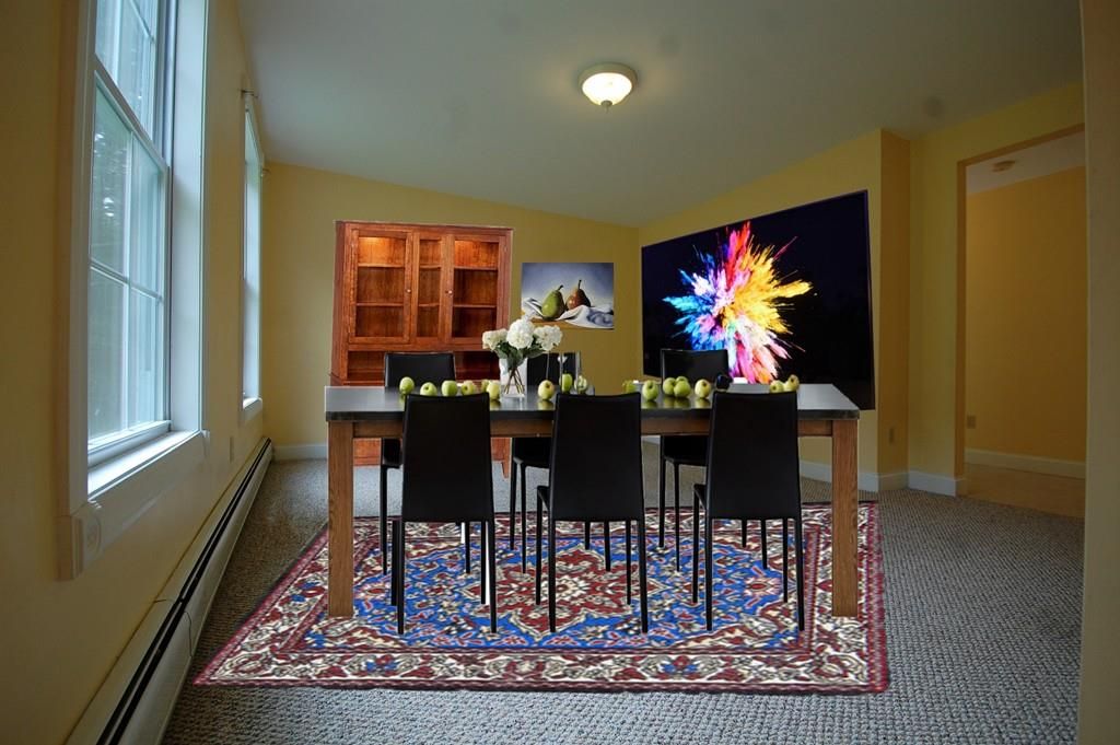  a virtually staged dining room with laughably bad virtual staging