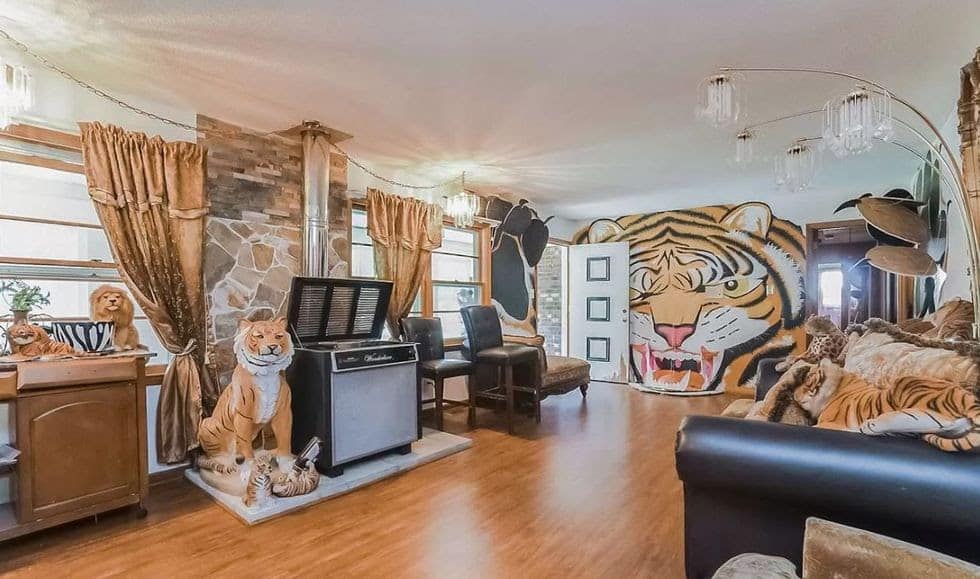 a living room filled to the brim with strange cat decor