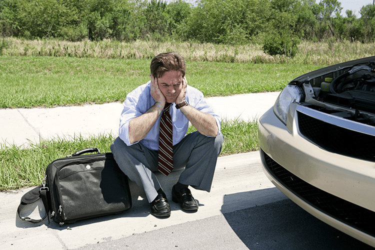 a real estate agent waiting on the curb