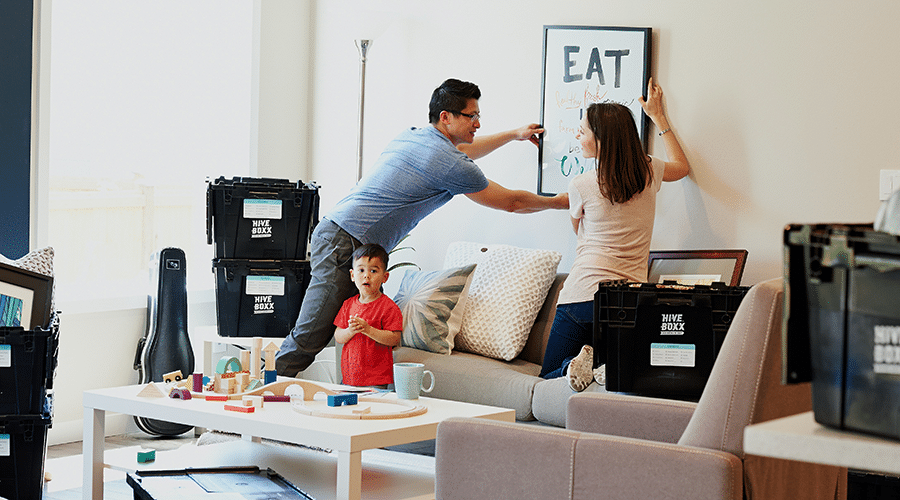 Happy family decorating their apartment