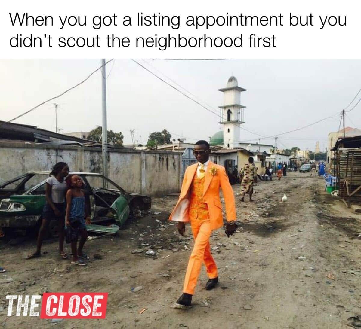 a man walking with his orange suit