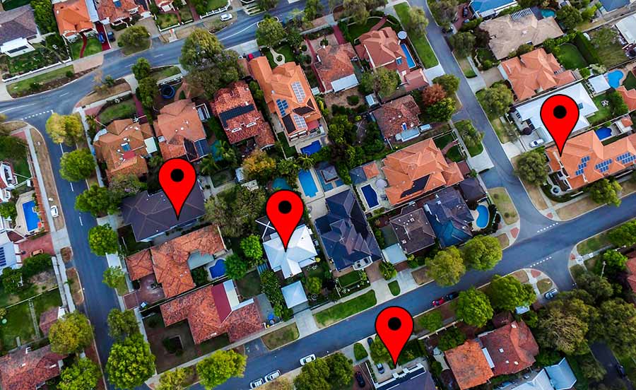 areal view of suburban neighborhood with map pins