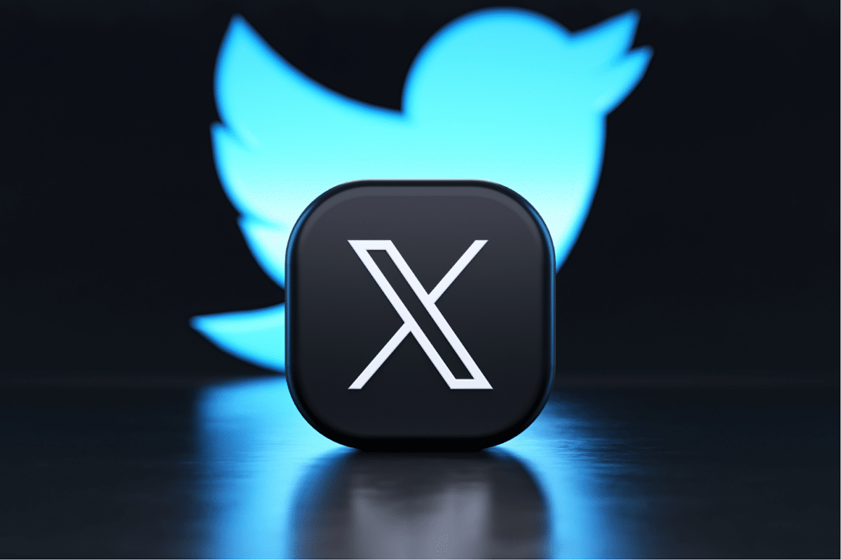 X logo with a faded Twitter logo in the background